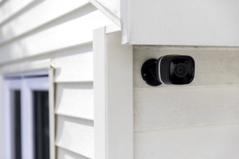 Black cctv outside the building, home security system.