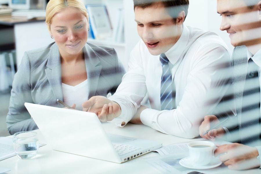 Image of people at a computer. Commercial Master Keying Locks.